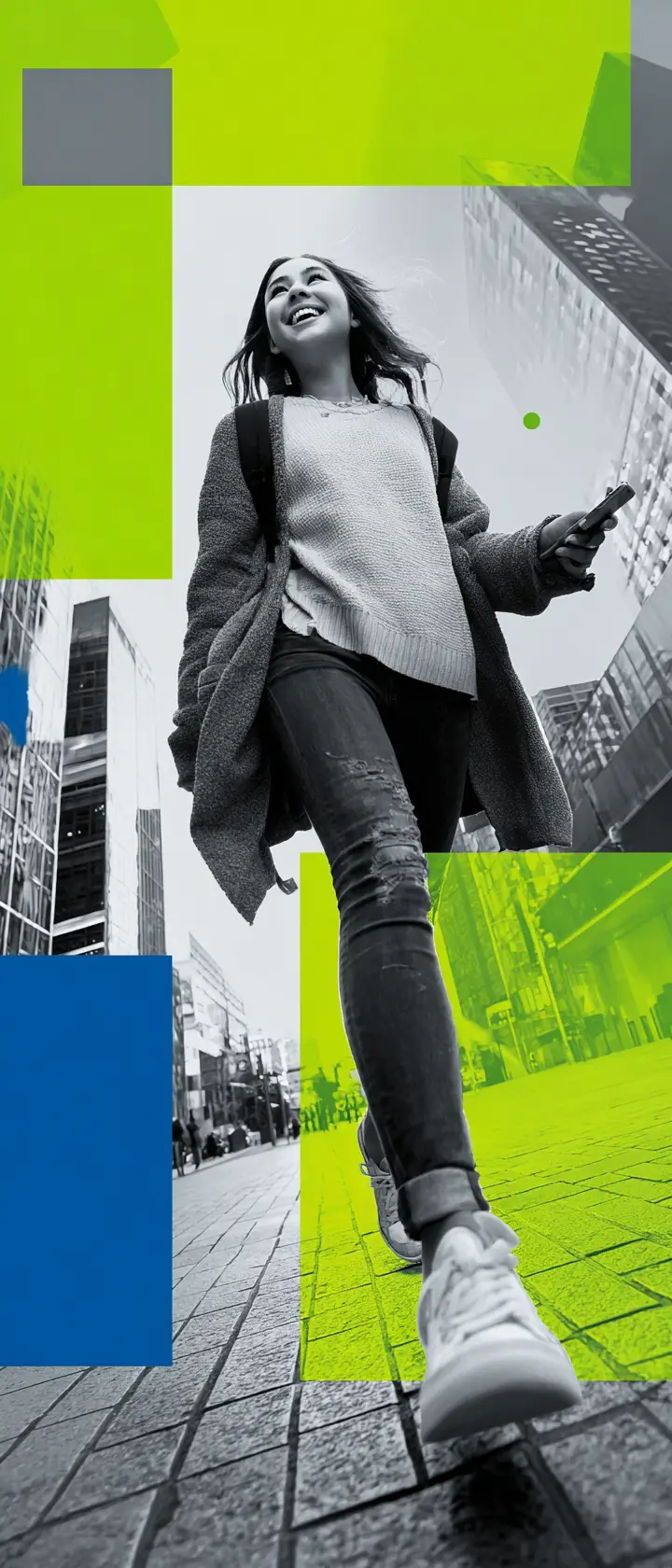 Smiling girl walking through the city with her phone