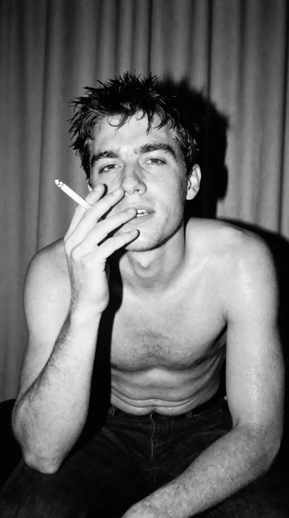 Gritty black and white portrait of a man smoking