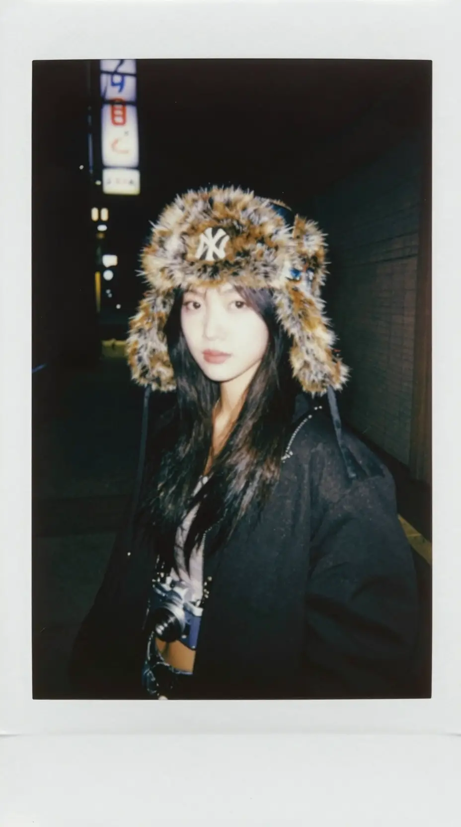 Asian model in y2k style with yankee faux fur cap