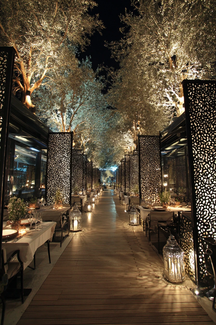 Romantic outdoor restaurant among tall trees with glowing lights