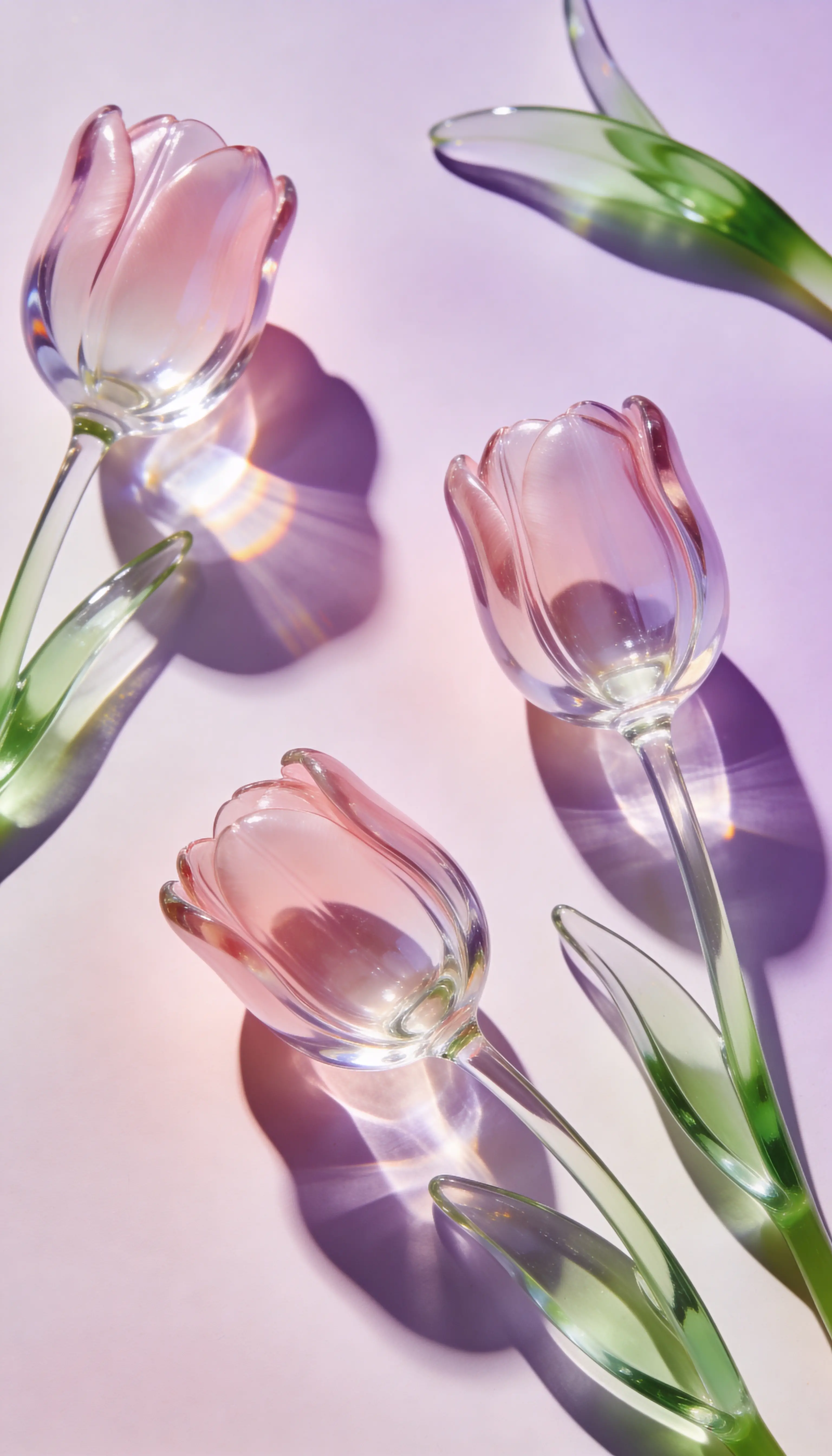 Translucent glass tulips in soft pastel pink and green