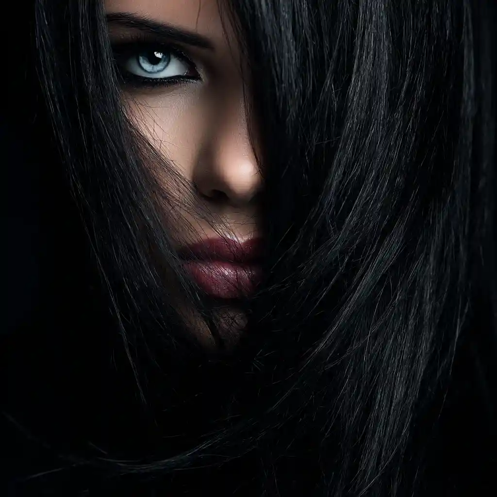 Gothic woman in chiaroscuro with piercing blue eyes