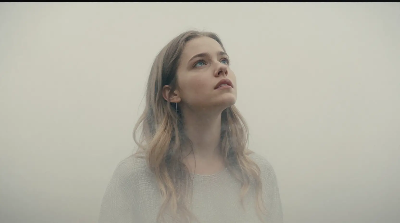Fading young woman gazing upward in delicate hatched lines