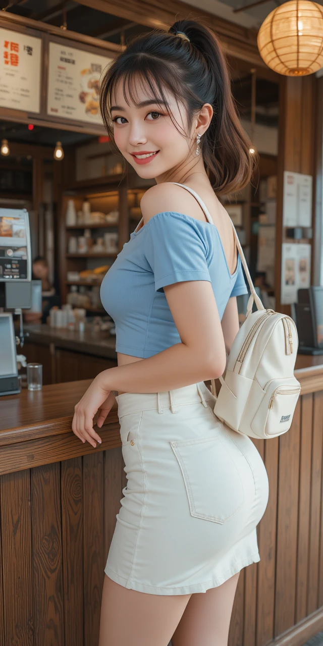 台式早餐檯前穿藍色上衣的甜美女子