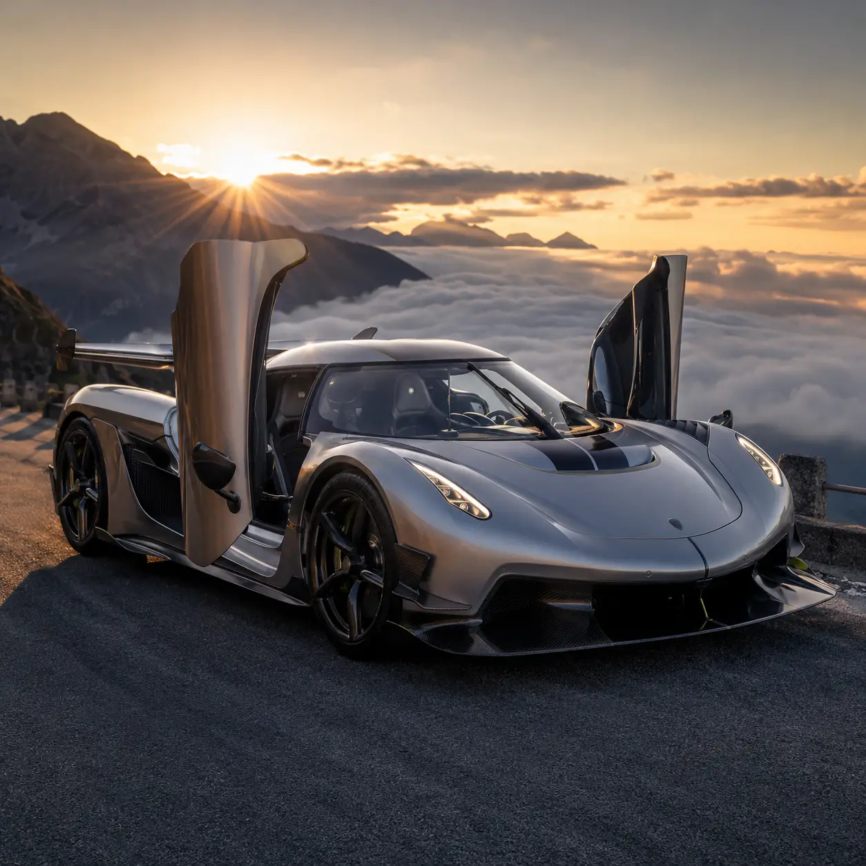 Silver hypercar on empty mountain road at sunrise