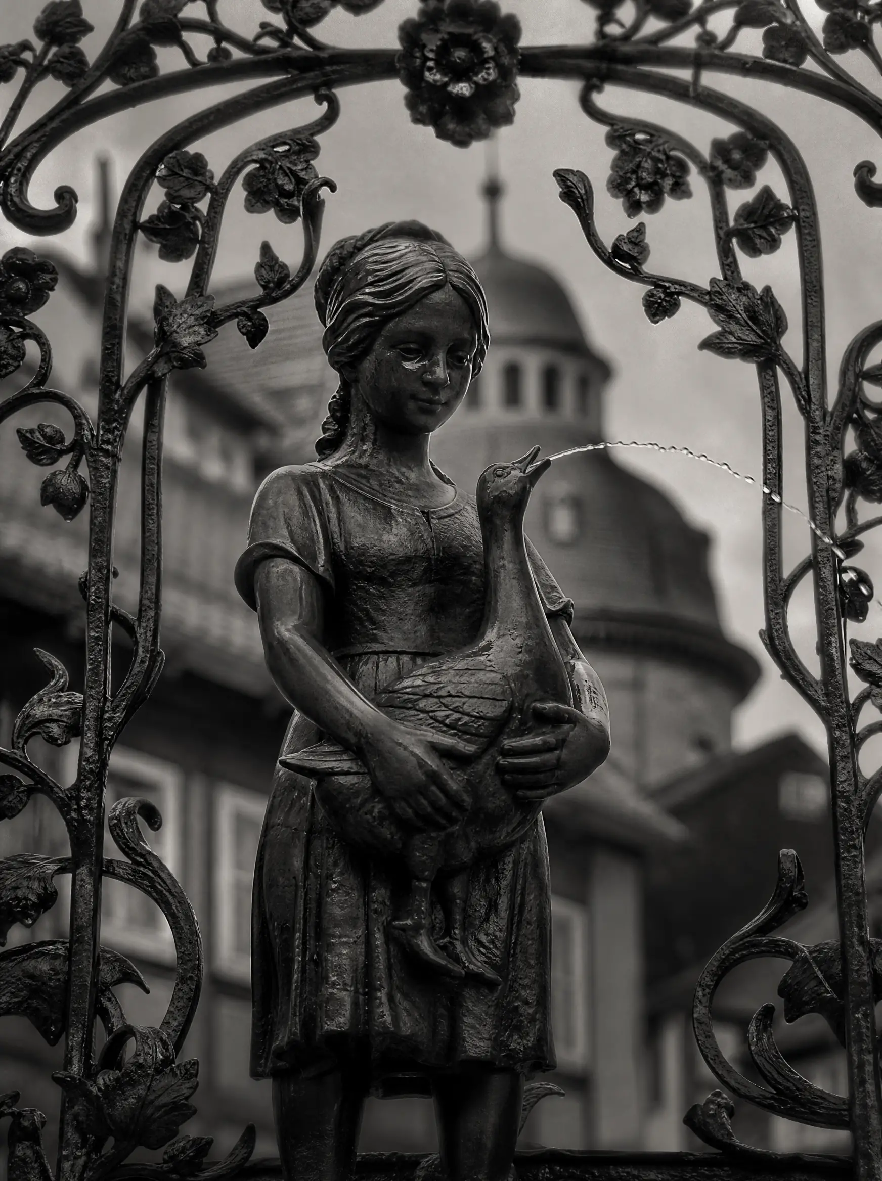 Close up of historic fountain sculpture with gentle water stream