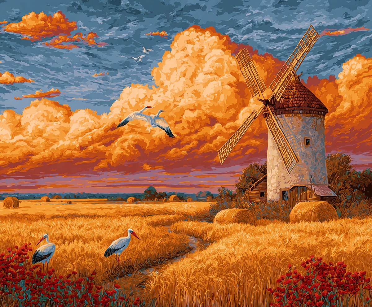 Moulin au coucher de soleil paisible sur des champs de blé dorés